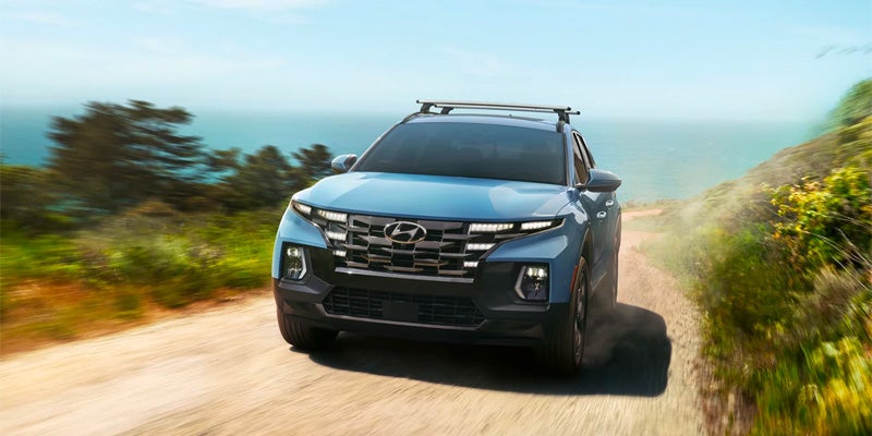 Hyundai Santa Cruz driving through countryside