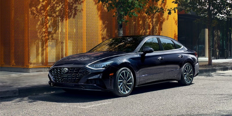 Hyundai Sonata parked outside modern building